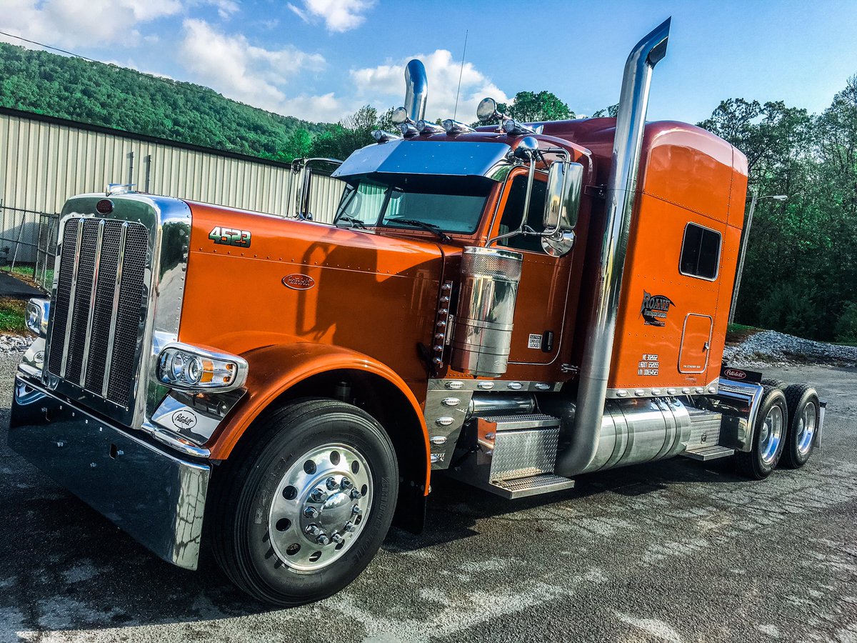 SamanthaF_Woody's tweet photo. We got two new @PeterbiltMotors today at work... I look short for once. But hey Happy Friday from us at #RoaneTrans!! #Peterbilt https://t.co/zbKPoghCZg