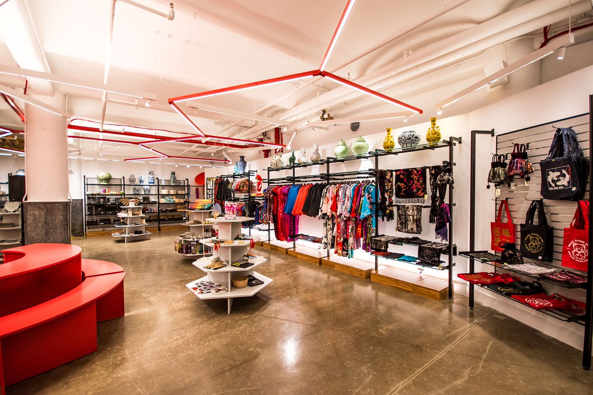 rakks's tweet photo. Custom shelving is a must for a memorable, branded retail experience. Supporting fine ceramics and other wares at @pearlriver_mart, our black pole mounted system with glass shelving contrasts with bright pops of red and white to create just such an environment. Space: @trastudio https://t.co/dfgTFtPGsH