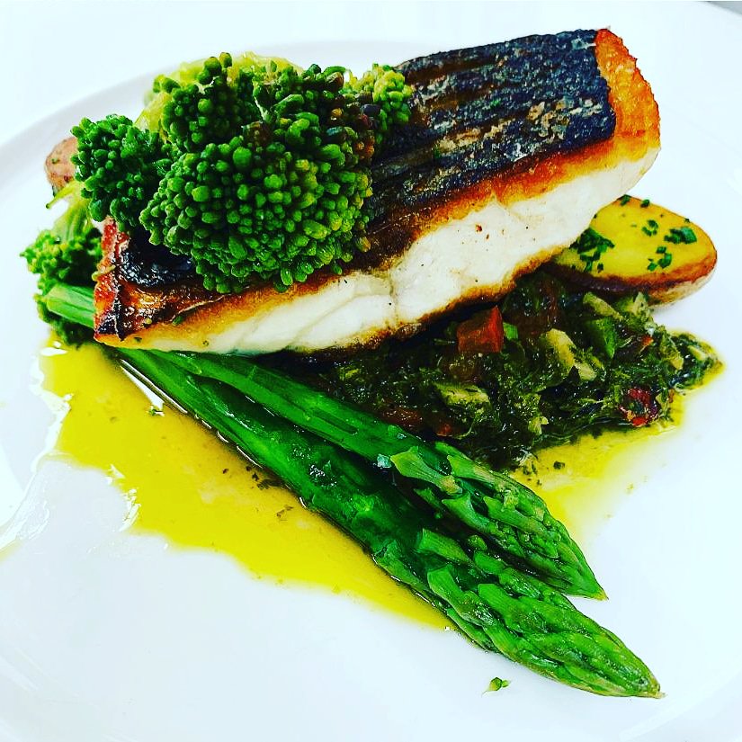 Today's Catch of the Day is this beautiful wild sea bass served with sauteed potatoes, asparagus, purple sprouting broccoli, vine tomato, caper and herb salsa....wow!