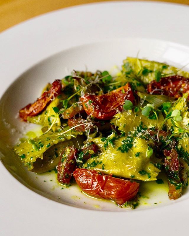 Spring is in full force. Chicken &amp; Spinach Agnolotti // spring onion pasta • pancetta lardons • basil &amp; arugula pesto • spring onion powder • oven dried tomatoes • Parmesan •