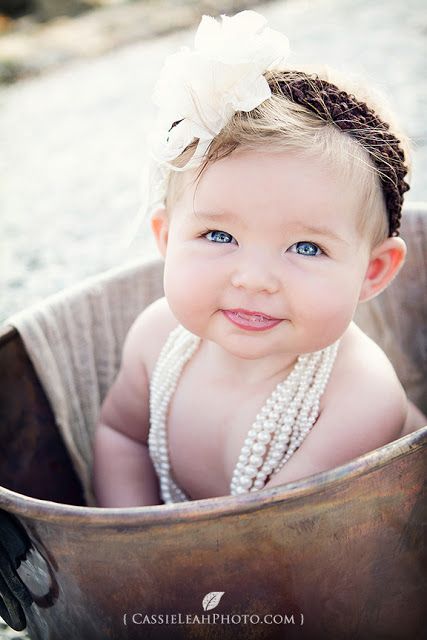 *Not even close to crawling yet but has finally figured out how to roll when Mommy doesn't have her trapped in a pot!*