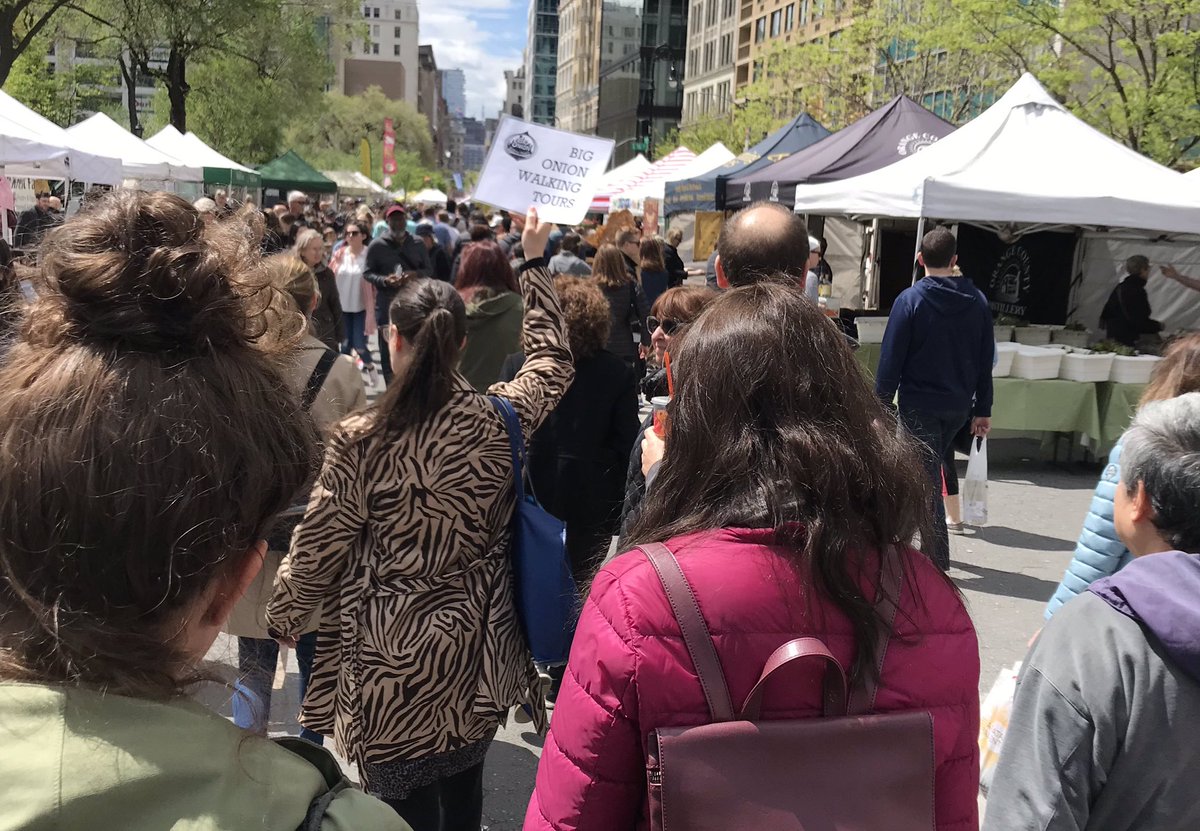 People follow someone old a tour sign in union square