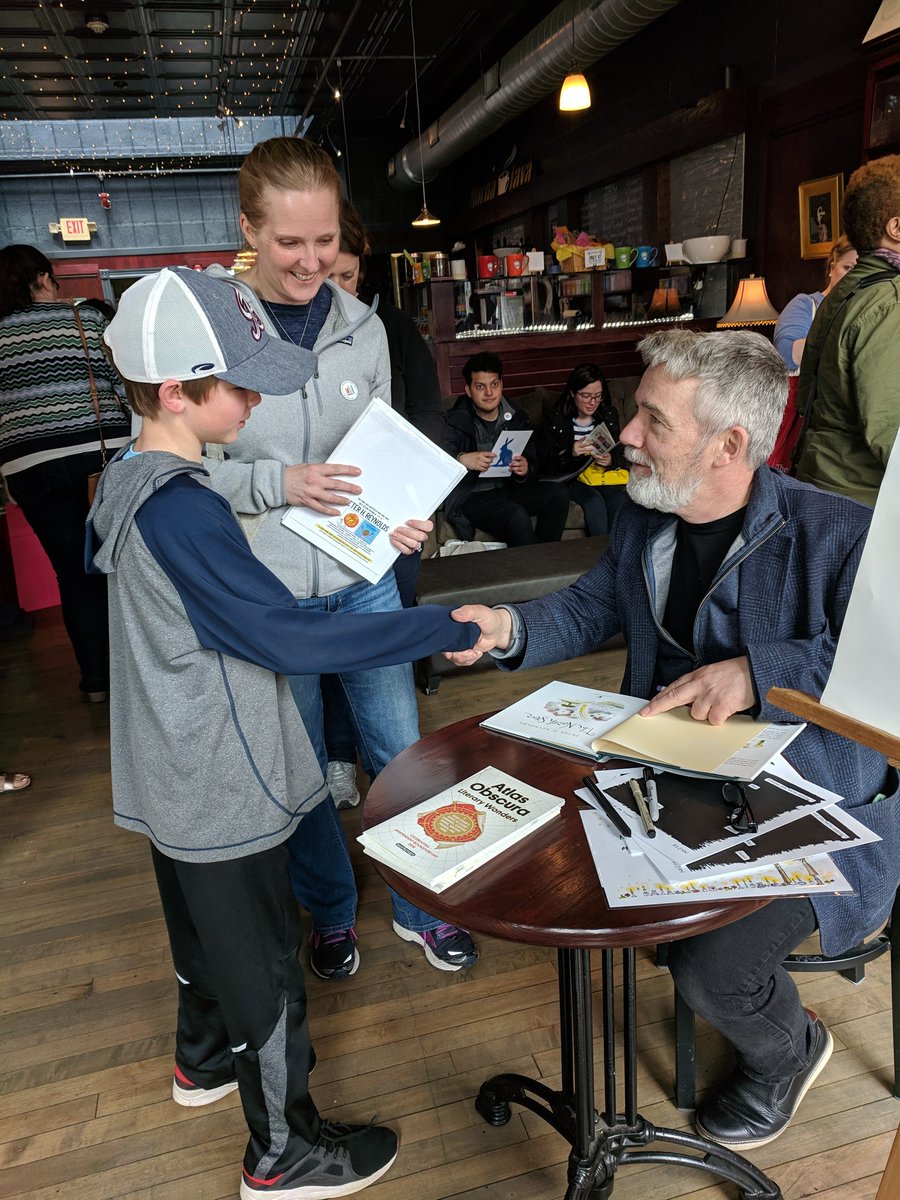 IBD_Boston's tweet photo. Peter Reynolds (@peterhreynolds) signing books for young trolley riders /readers at @BlueBunnyBooks! https://t.co/a08hcOQYEN