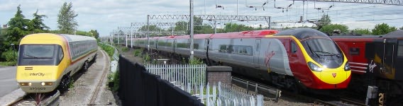 TILTING TWINS.... First generation #Class370 370003 #APT along its younger sibling @VirginTrains #Class390 390006 #Pendolino '#MissionImpossible' at @CreweHC 16/06/02.... 📷#RGLatham.... @RailwayCentral