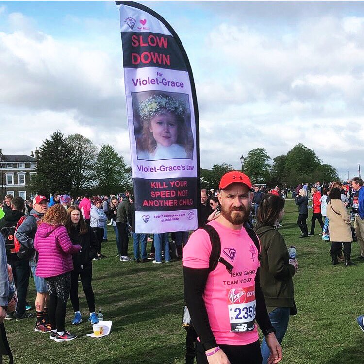 Glenn Youens runner 23519. Running with his #SlowDownForVioletGrace flag raising awareness of our petition for tougher sentences for death by dangerous driving. #VioletsLaw parliamentary debate is on June 3 #GetInspired