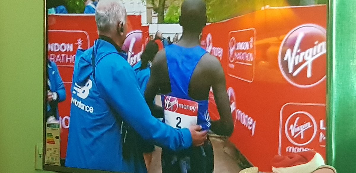 FelicityRodger's tweet image. Who is this man with the moustache? Get rid of him. Pulling the arm of an athlete who's just ran 26 miles. LEAVE HIM ALONE! #LondonMarathon