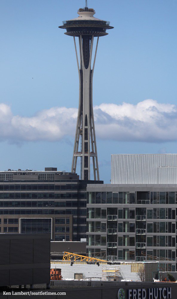 SeaTimesFotoKen's tweet image. A section of crane is seen on a roof, Sunday in Seattle. Here is the latest information, plus other stories relating to Saturday's deadly crane collapse: seattletimes.com #cranecollapse