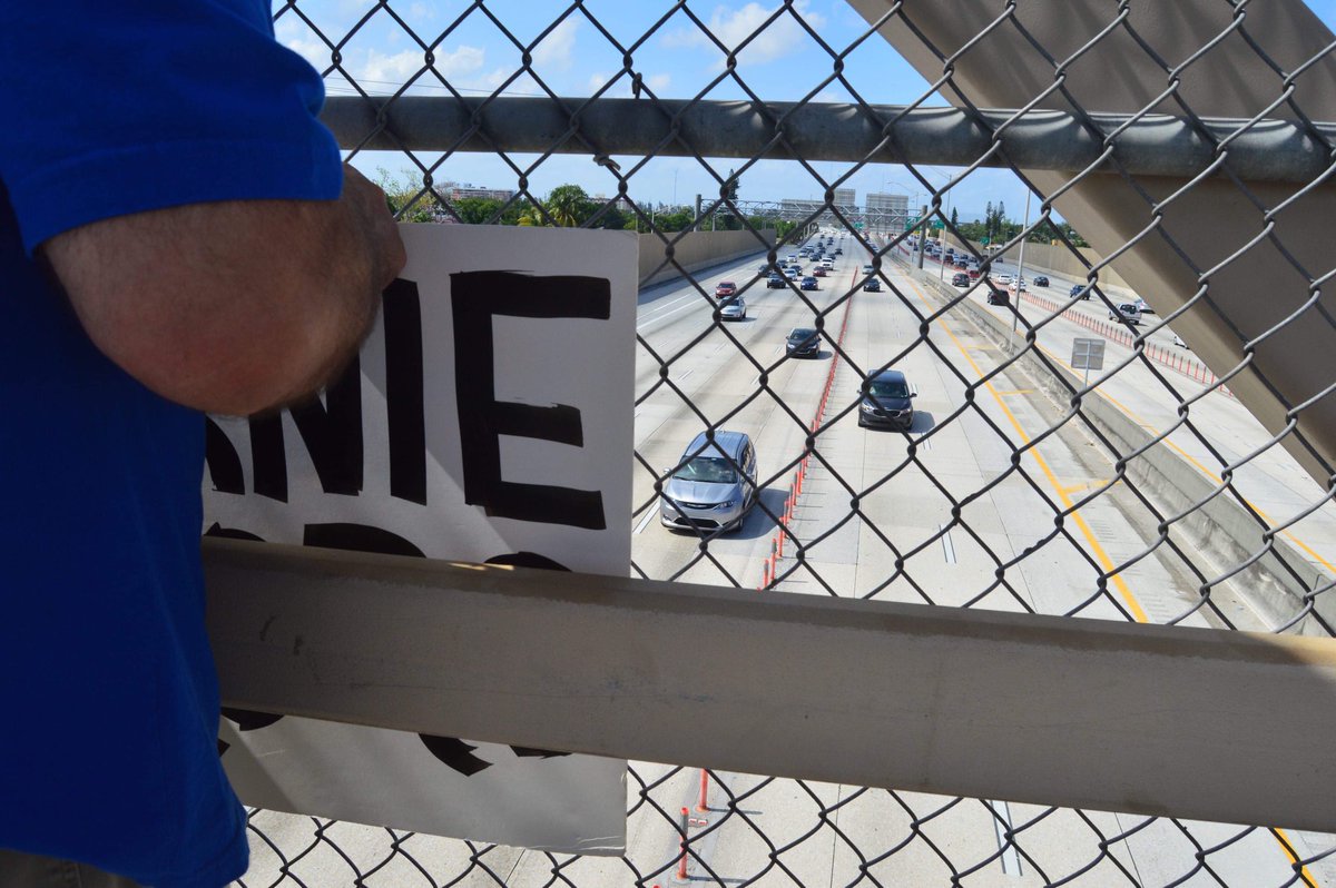 OurRev305's tweet photo. We had a BLAST at our Bernie Banner Drop (despite 84 degree temps). 🥵 All the honking kept us energized! #OurRev305 #OurRevolution #Bernie2020 #OrganizeForBernie #MiamiForBernie #BerningInMiami https://t.co/q992zFCuw1