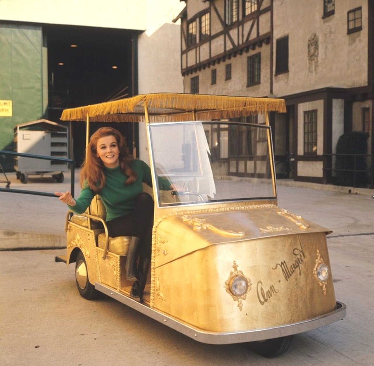 Ann-Margret! A-M in a gold golf cart ...