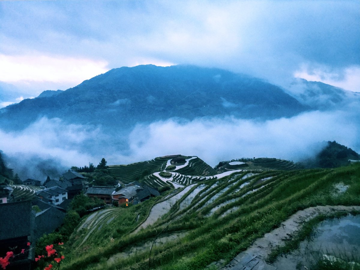 Easy_Tour_China's tweet photo. In May the rice terraces at Longji near #Guilin will be filled with water. It is a good time to take photos of cloud sea, water reflection, as well as the ethnic people. https://t.co/6LuD2dGmT2