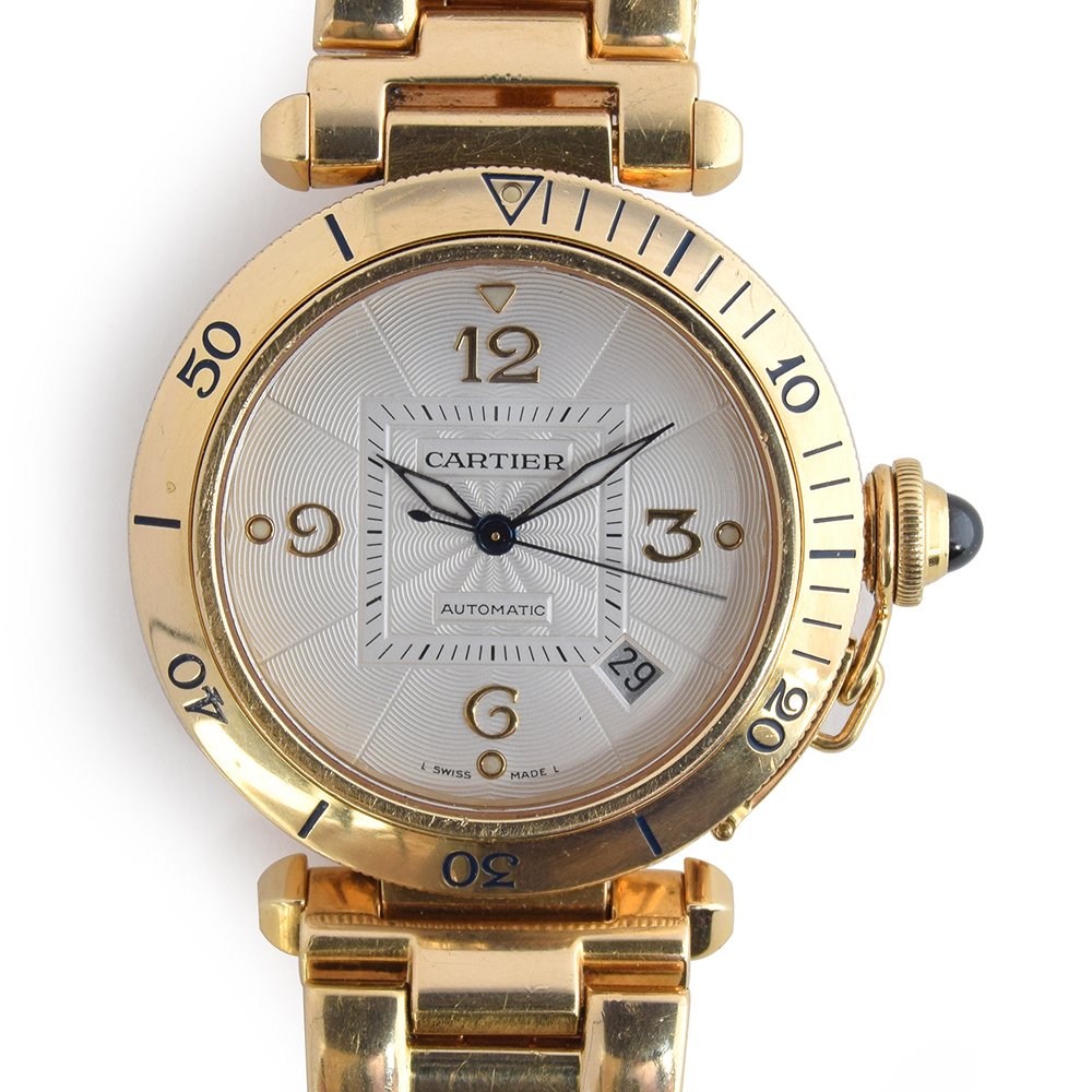 Lot 94 - A fine Gentleman’s 18ct Gold Pasha de Cartier BRACELET Watch
CIRCA late 1990s, REF 2392, ENGINE TURNED SILVER DIAL, APPLIED ARABIC NUMERALS, SWORD HANDS, DATE APERTURE. Cartier box.
*Weight gross 156g.
Movement: 27J, automatic, cal 191.
£5000-£6000