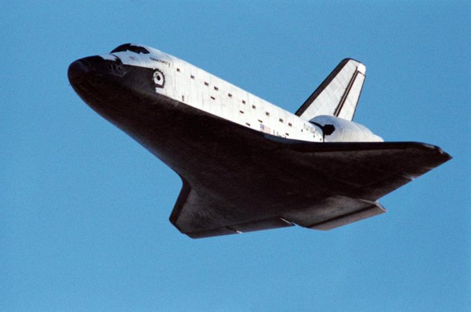 Low angle view of the Space Shuttle Discovery as it approaches for landing at Edwards Air Force Base. This picture was taken just before landing gear deployment.