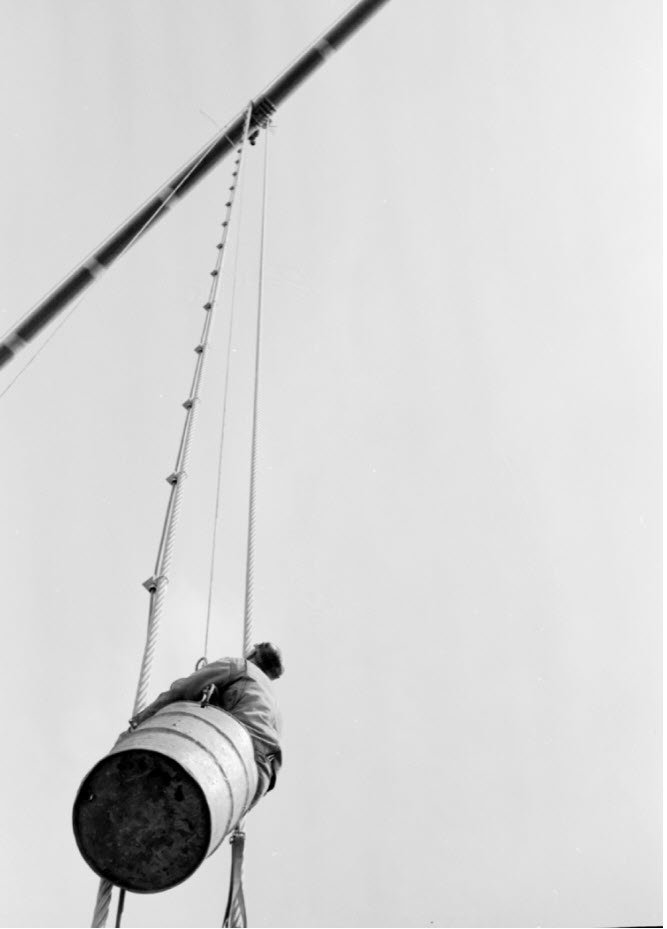 mackinacbridge's tweet photo. If you cross @MackinacBridge this summer, you may see our maintenance crew working on the cables, but we no longer send our crew up in a modified steel drum. They are lifted using a steel basket these days! It's safe to say that our maintenance has never been afraid of heights! https://t.co/d9xtA5iQFh