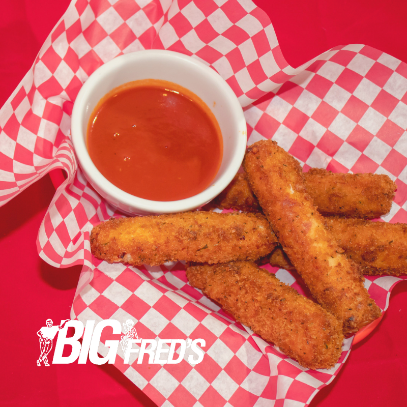 BigFredsPizza1's tweet photo. Big Fred's mozzarella sticks are house-made daily. We slice a fresh loaf of mozzarella cheese before breading and deep frying each stick. They are served with a side of Big Fred's pasta sauce. #bigfreds #mozzarellasticks #mozzarella #fresh https://t.co/ozxZ1LIuCi