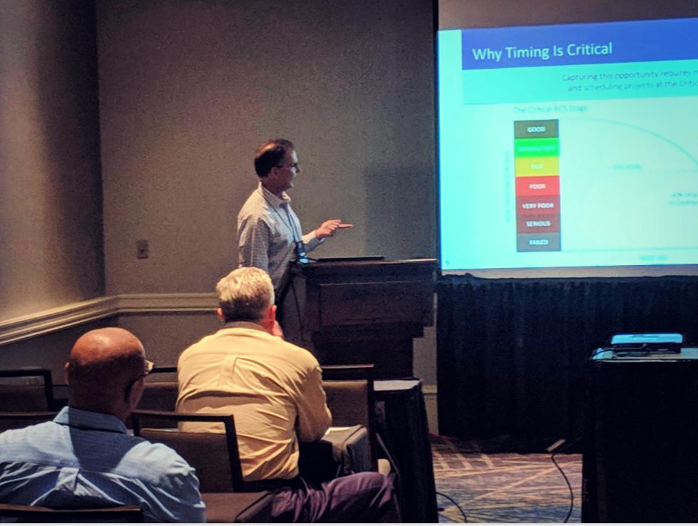 BLUEFINLLC's tweet photo. Our VP, Jim McNulty, demonstrates to Facilities Management Summit @ForumEventsUSA attendees why timing is critical in managing a portfolio of roofs at the lowest possible cost. Contact us today to learn about the BLUEFIN way to portfolio roof asset management! #roofconsultants https://t.co/GTwmWRfAOv