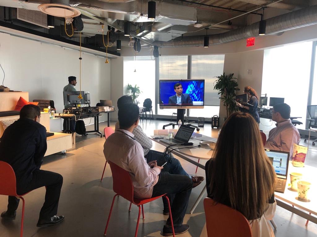Employees in our New York office watch <a href="/imravikumars/">Ravi Kumar S</a> live at #MIglobal.