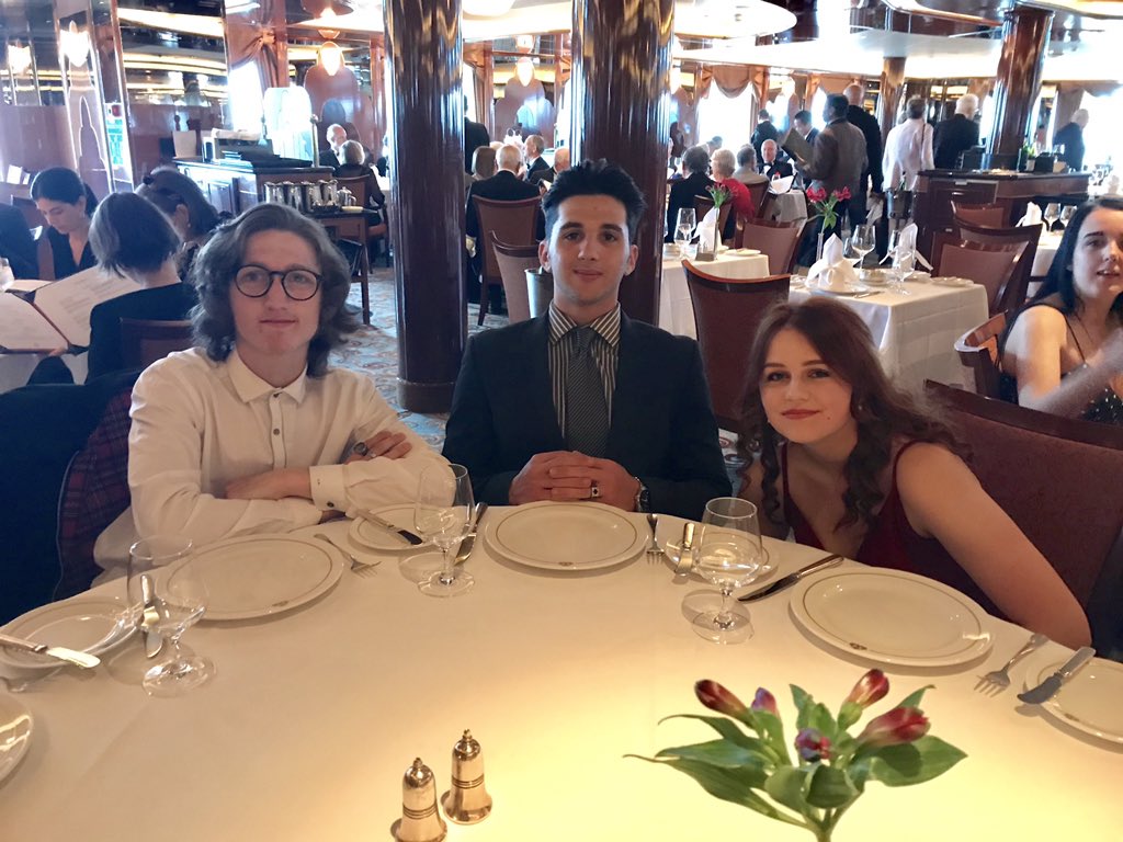 TravelHighbury's tweet photo. Fine dining and perfect company at dinner on the @Cunard Queen Victoria. The @HighburyCollege Cruise students really look the part and are enjoying the wonderful food. https://t.co/KzCmFlzkxx