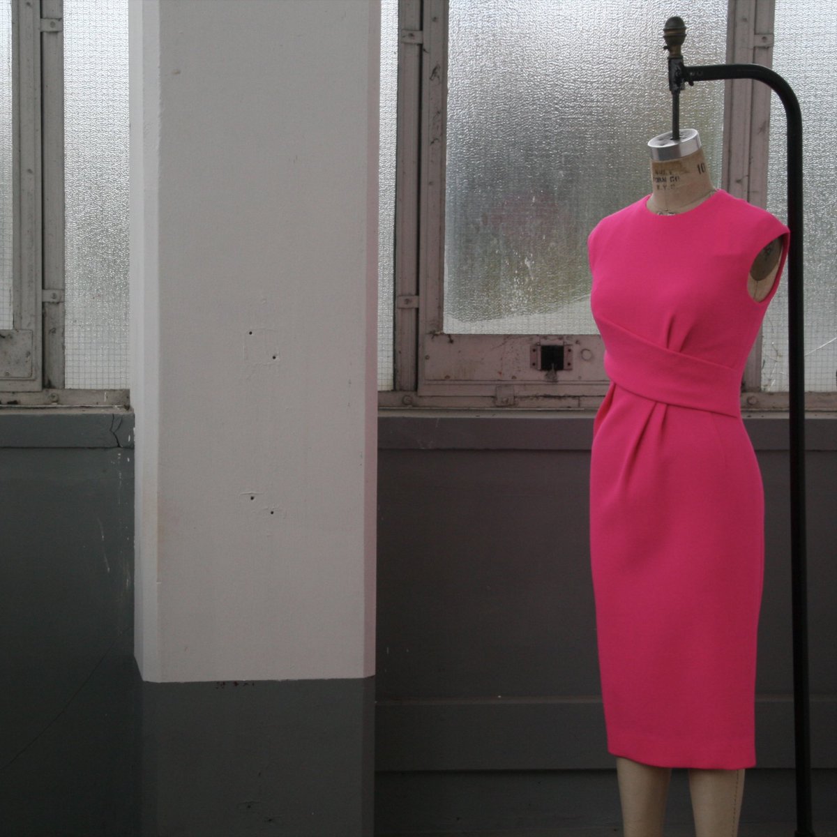 The twisted waist detail and Candy Floss Pink shade makes the Charlotte dress a standout piece of this collection. #DB2019