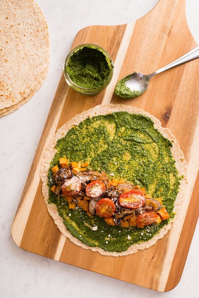 A hearty spread of pesto on a whole-wheat tortilla is where you should begin when putting together this unique wrap.

Then simply add roasted sweet potatoes, mushrooms, tomatoes, and a bit of Parmesan, and lunch is served! bit.ly/2tP076S