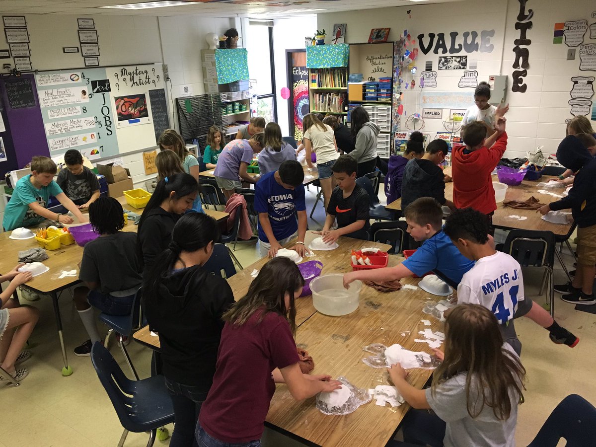 5th grade busy making plaster masks