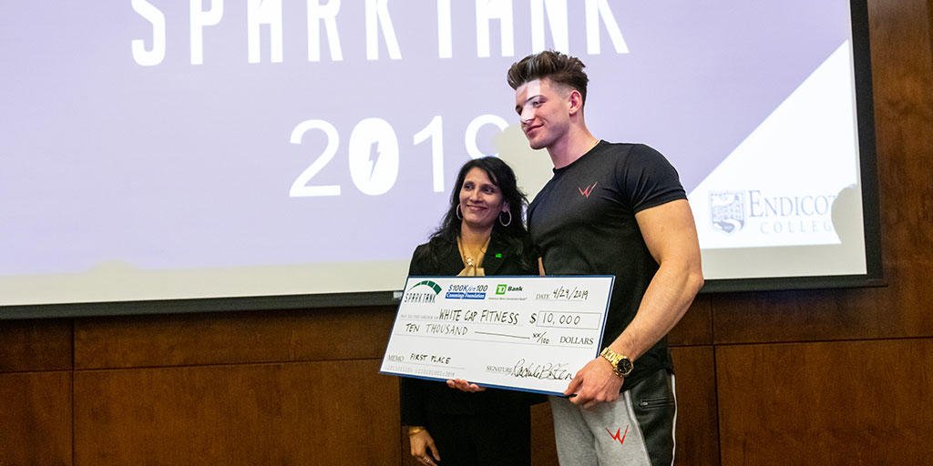 Noah Fearnley '21 (entrepreneurship) next to Jugmi Rao, VP at <a href="/TDBank_US/">TD Bank</a>—TD Charitable Foundation is a sponsor of Spark Tank 2019.

Fearnley's company, Whitecap Fitness, enters the #AthLuxury market with unique designs and innovative materials to reach a younger demographic