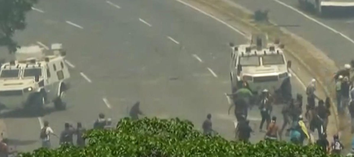 Socialist Venezuela on the brink - military tank runs over opposition supporters