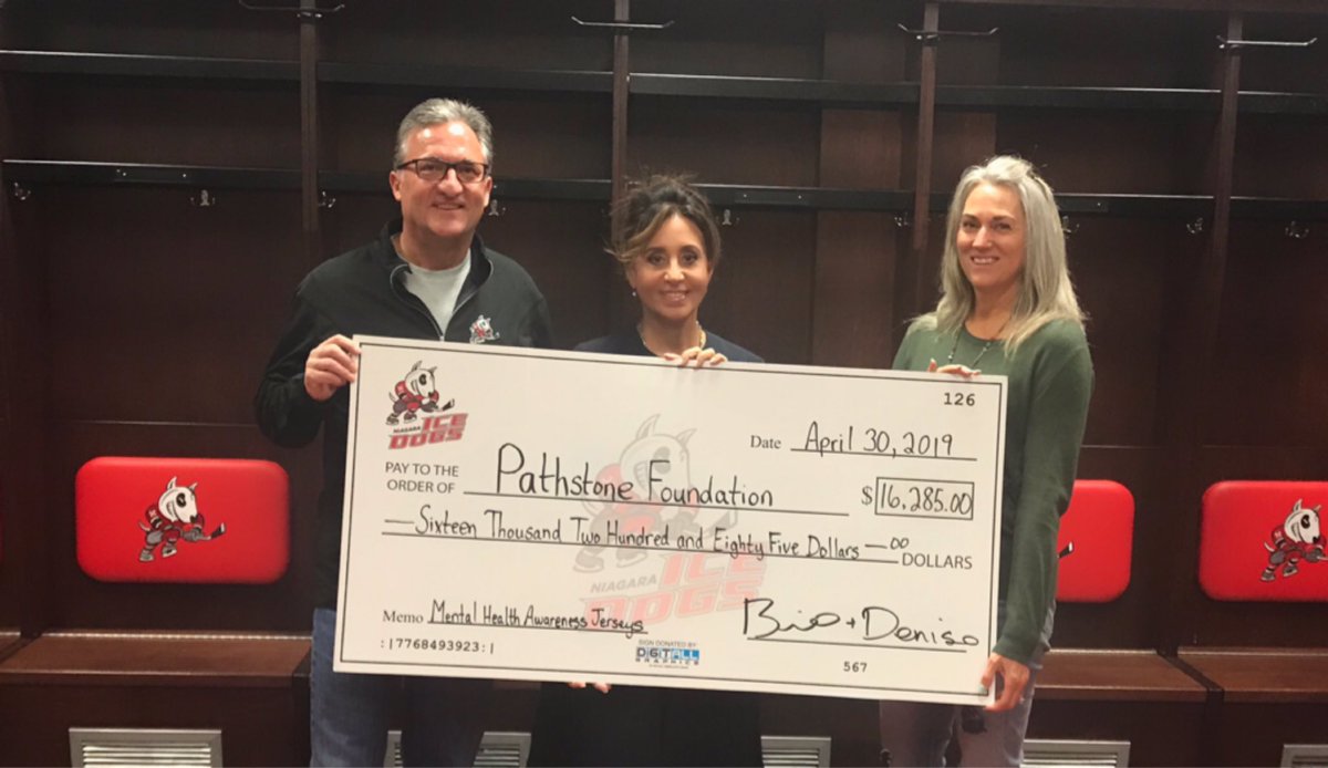 pathstonemh's tweet photo. A big THANK YOU to Bill and Denise Burke and the @niagaraicedogs for their donation of $16,285! Proceeds came from the sales of their jersey auction featured at Pathstone Night this past January. We couldn’t do what we do with out people &amp; businesses like you #pathstoneniagara https://t.co/ffjePXsKbF