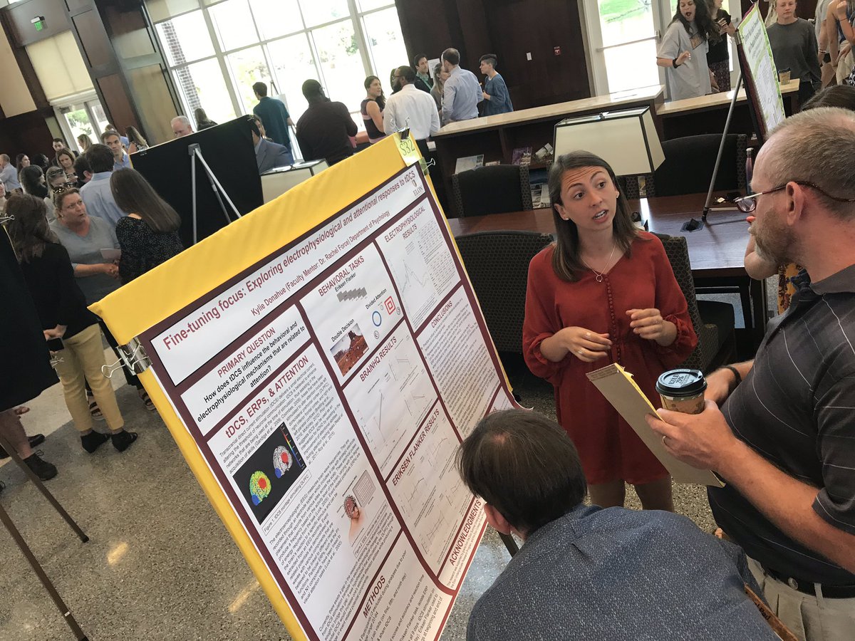 ElonBiology's tweet photo. Kylie Donahue (Bio’19, Force PSY lab) looks at attention and electrophysiological response in her #elonSURF poster #elonbioresearch https://t.co/VGvd03N5qY
