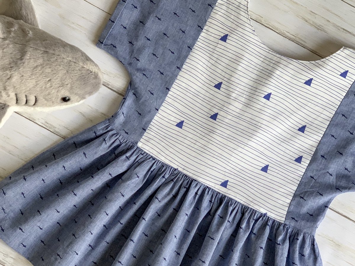 SewManyPins's tweet photo. A shark shirt for my shark loving 9 year old. She asked for sharks, but it was difficult to find a print that didn’t look too juvenile. I think I found the perfect pair. The pattern is a Pixie top from @violettefieldthreads 
#sewmanypins #shark #learningtosew #sewing #sew https://t.co/QPOAvTNhyp