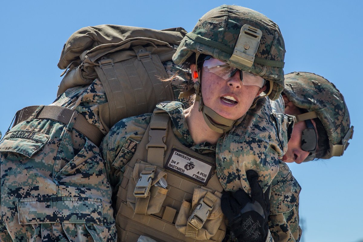 Autumn Taniguchi, a rifleman with 1st Marine Division, performs a fireman c...