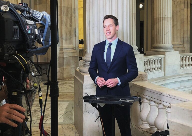 Senator Hawley prepares to speak with Martha MacCallum