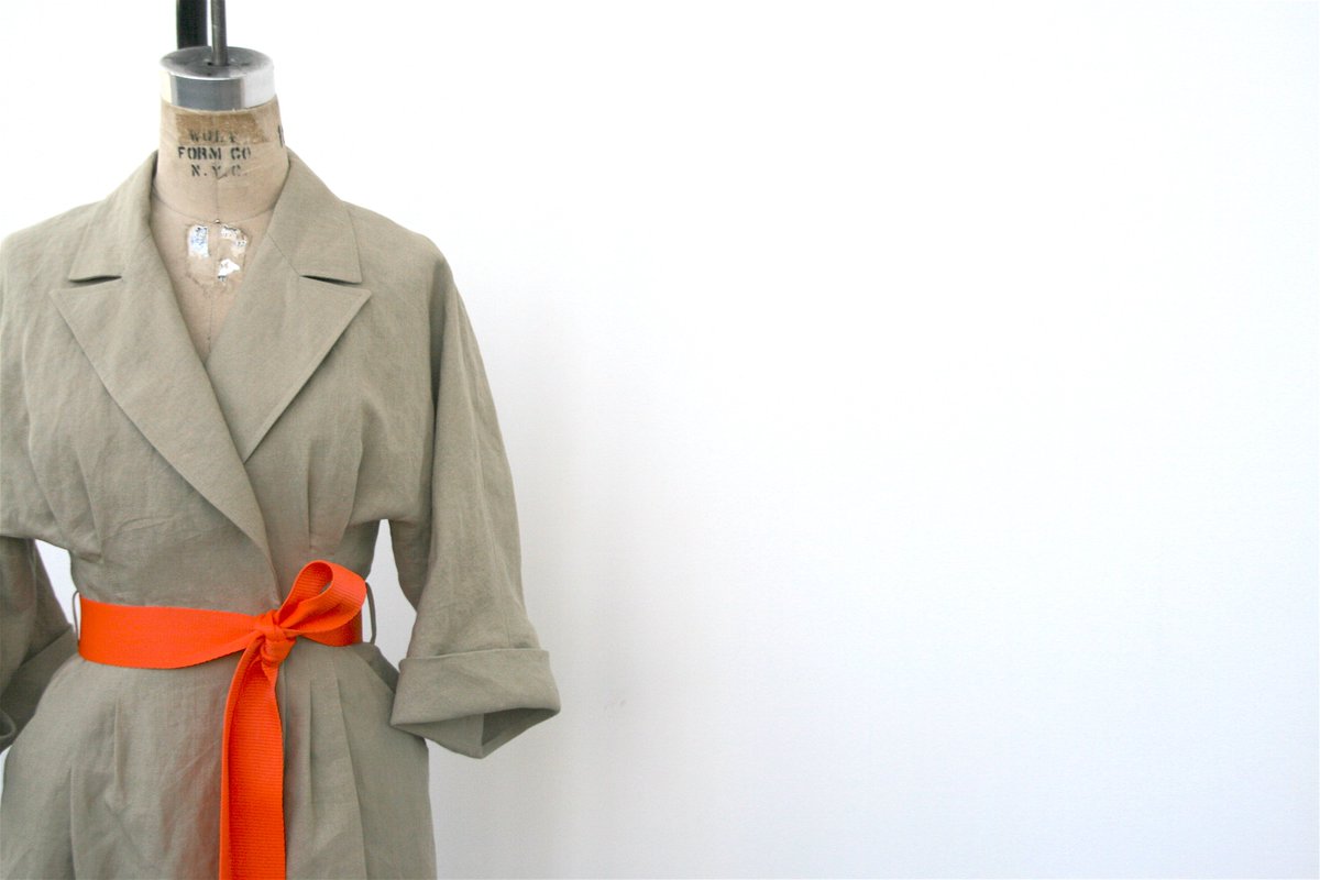 It’s all in the details - a vibrant spring orange belt makes this Kimono Safari Dress a standout piece.  #DB2019