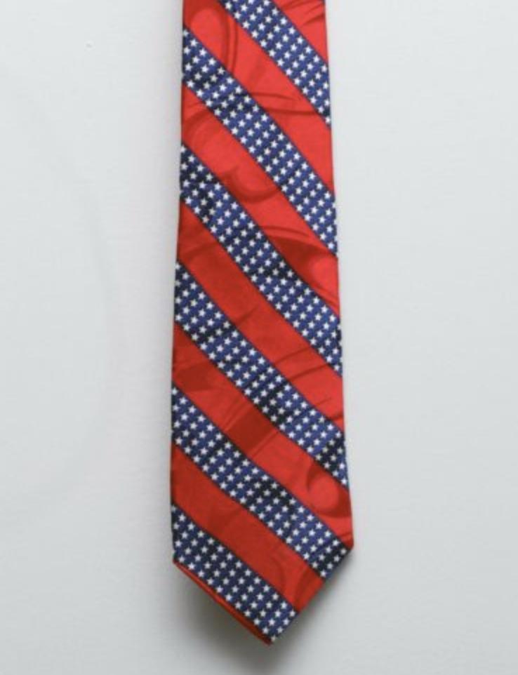 BlogGuero's tweet image. I'd like to tell a short story about America. It begins with me listing a necktie on Ebay. It was this tie. I used to wear it on the 4th of July, but I've been downsizing so I decided to sell it.