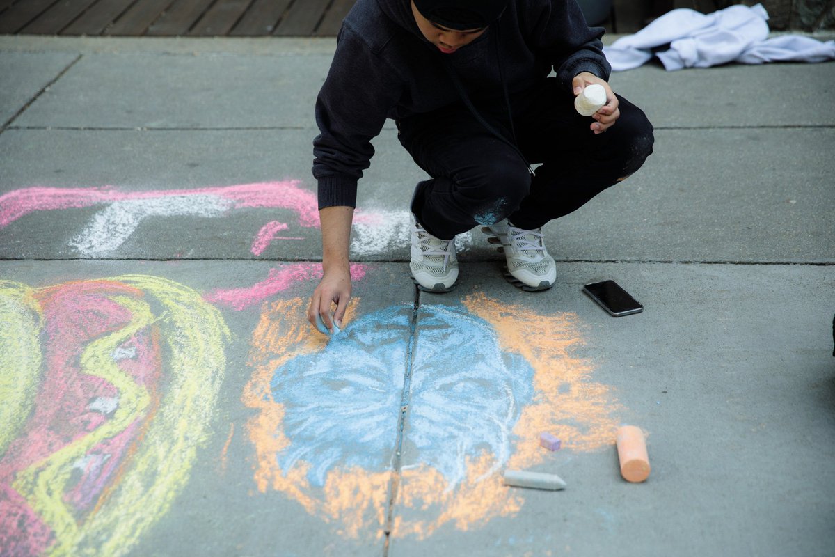 student drawing the game of thrones night king in chalk