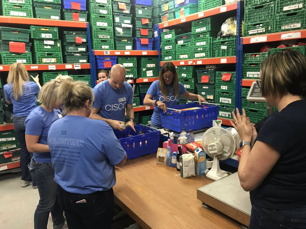 JoanneBugg's tweet photo. 14 million people in the UK live in poverty. We did a small part to help by sorting and storing donated items at a Food Bank. What an operation. We learned so much; we will do more. #WeAreCisco #foodbanks @TrussellTrust #LoveWhereYouWork https://t.co/nWxFhYzRZD