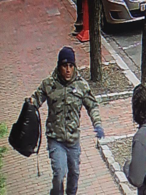 camo jacket with blue jeans