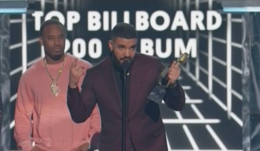 etalkCTV's tweet photo. Top Billboard 200 Album goes to @Drake, with a #GameofThrones reference! "Shout out to Arya Stark for putting in that work last week!" FACTS. 🏆🏆 #BBMAs #BillboardMusicAwards https://t.co/Sl3hpgWxQ4