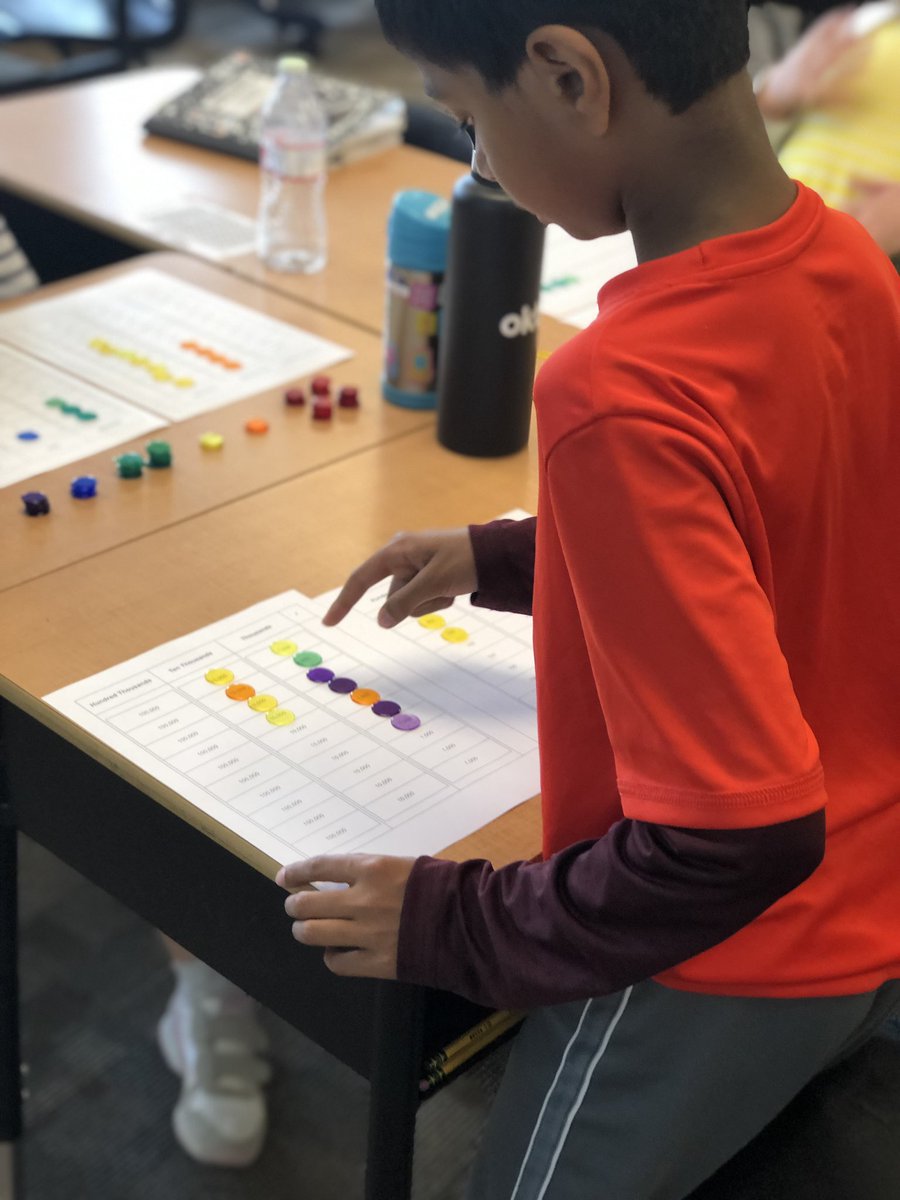 Mrs_Moore4's tweet photo. We’re playing The Plus and Minus Game to review the place value system! There were lots of squeals and cheering when they were able to regroup and move their counters on their place value boards @EMathRRISD @ElsaEngRRISD https://t.co/IlcjNuvawV