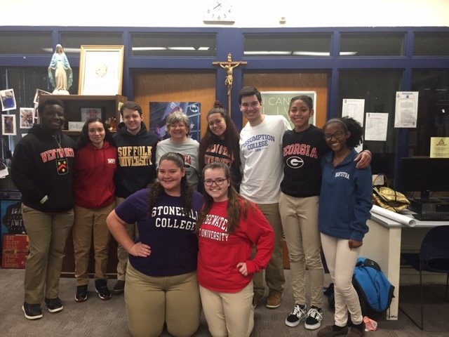 Here are some of our staff and students wearing their college shirts! 1/4