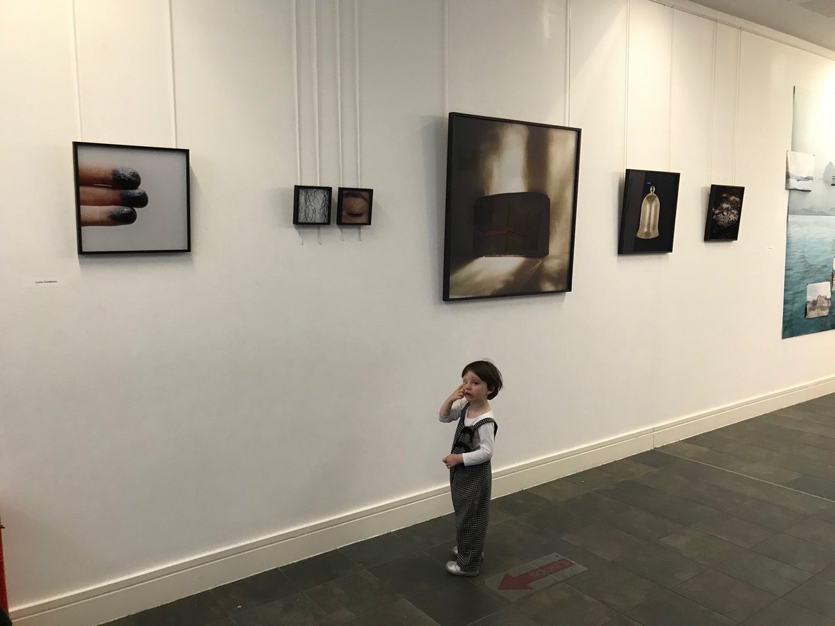 Rather belatedly, here is an installation photo from my exhibition shown ⁦<a href="/formatfestival/">FORMAT Festival</a>⁩ - my daughter showing great interest in the photograph of an eye, appropriately!