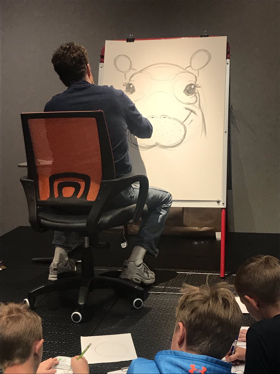 prosisefrisco's tweet photo. Illustrator @richardcowdrey sharing his work at Frisco Elementary and teaching us his craft. Drawing his hippo character Fiona based on the real-life baby from the @CincinnatiZoo. @FREprincipal https://t.co/o1kB7ew9SI