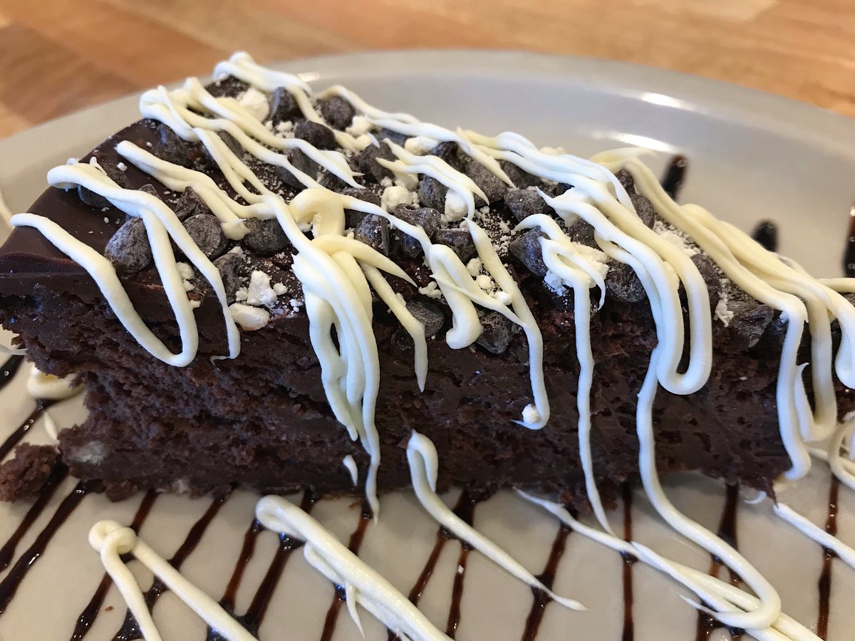 TrainWreckBar's tweet photo. Now on the dessert menu—come in and dive into a slice of our newest recipe—Triple Brownie Cheesecake, $7.50. Chocolate cheesecake baked on a brownie crust and topped with chocolate ganache, scattered with dark &amp; white chocolate. #trainwreckbarandgrill https://t.co/WriF7VBHlI