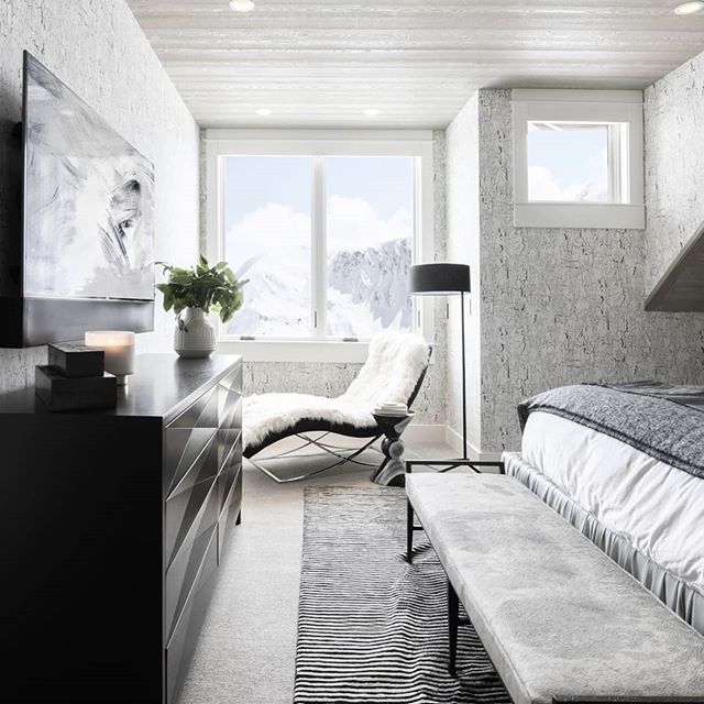 Black and white dream of a bedroom. What's not to love about the incredible view enjoyed from a faux fur lounge chair? #alderandtweeddesignco #interiordesign #luxurydesign bit.ly/2H00nHM