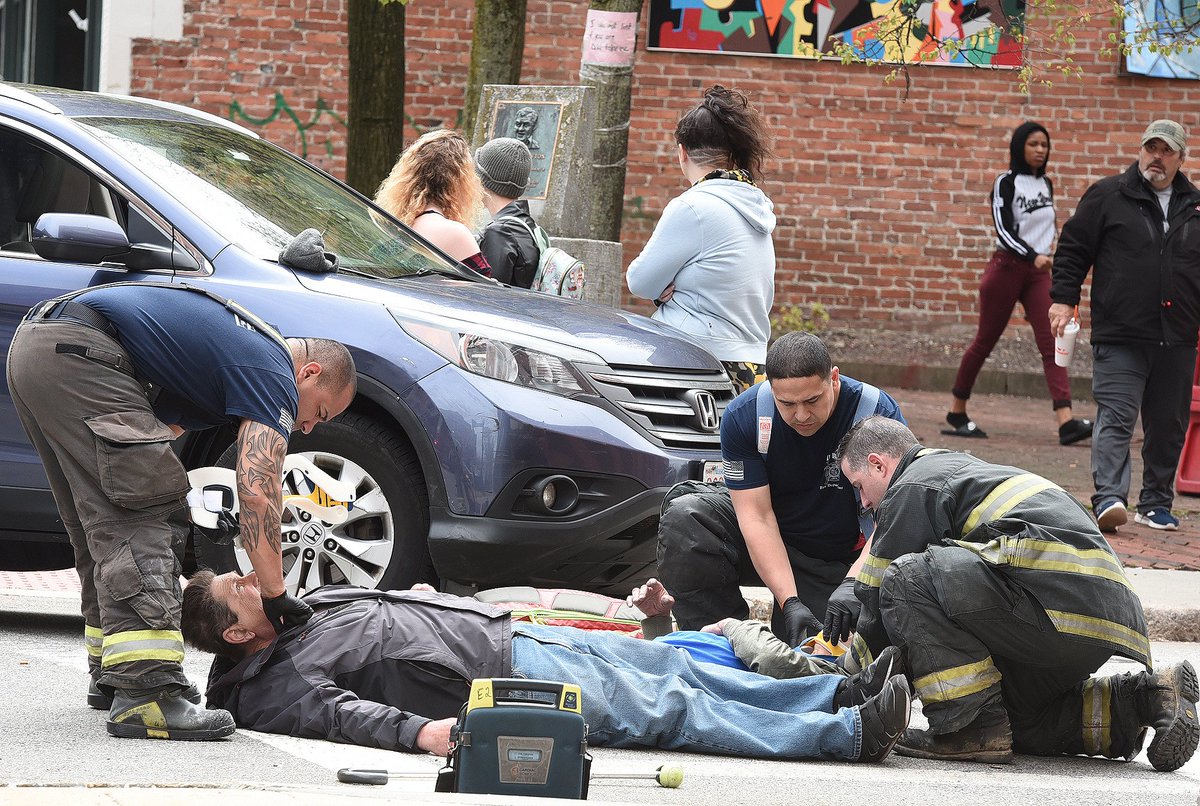 Engine Co. 2 firefighters attend to two men reportedly struck by the car seen behind them, a short while ago at the corner of South Main and Anawan Streets. The injuries appeared not terribly serious, and there's more to come at heraldnews.com