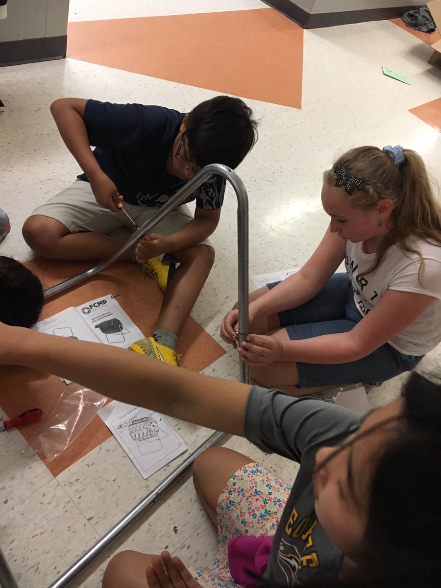 May EcoClub Meeting: the thunderstorm kept us indoors again, but we worked hard recycling, making plans for projects, and building a compost bin.