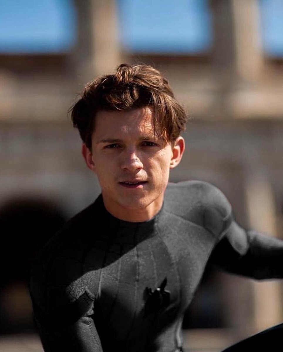 flickerrosesnjh's tweet image. tom holland in a black spidey suit is hot. that’s the tweet.