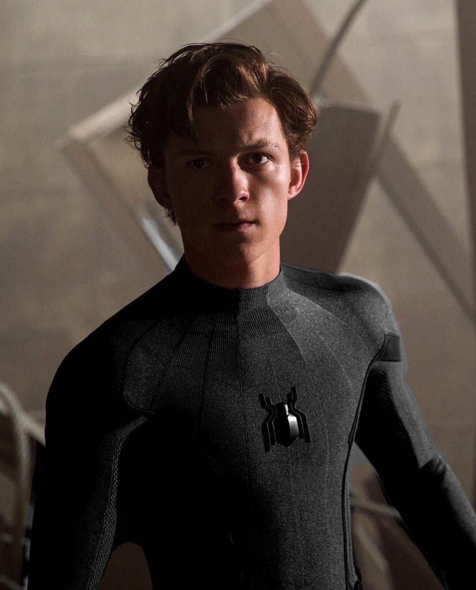 flickerrosesnjh's tweet image. tom holland in a black spidey suit is hot. that’s the tweet.