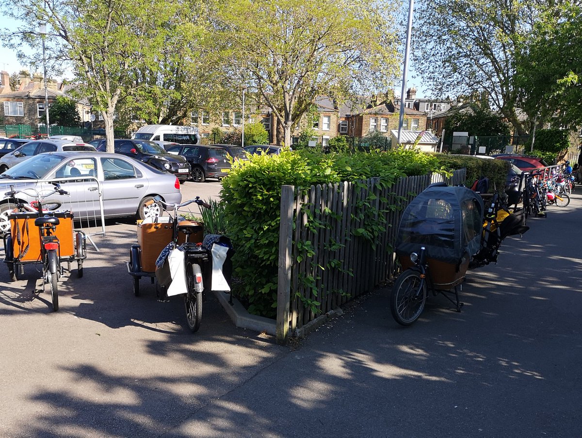 Three cargo bikes (none of which are mine) and at least a hundred more kids' cycles parked outside my children's primary school yesterday morning.

This isn't Amsterdam. This is an ordinary outer London suburb that has invested in active transport. #wfminiholland.