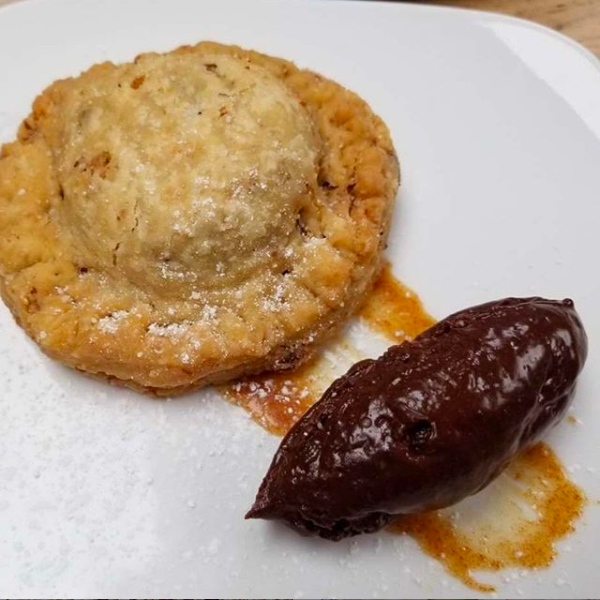 It's Friday — treat yo'self with The Bluegrass, our fried walnut pie served with chocolate mousse. It's our version of the Kentucky Derby Pie. #cltdining #desserts