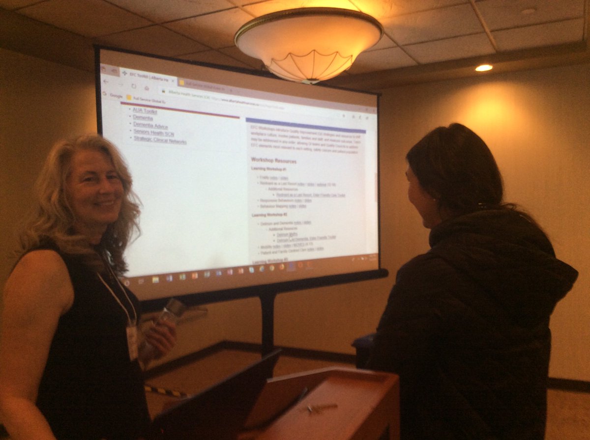 Verdeen (AHS Seniors Health Strategic Clinical Network) shows some of the Elder Friendly Care Toolkit resources available online to an interested attendee at #CGNA2019.